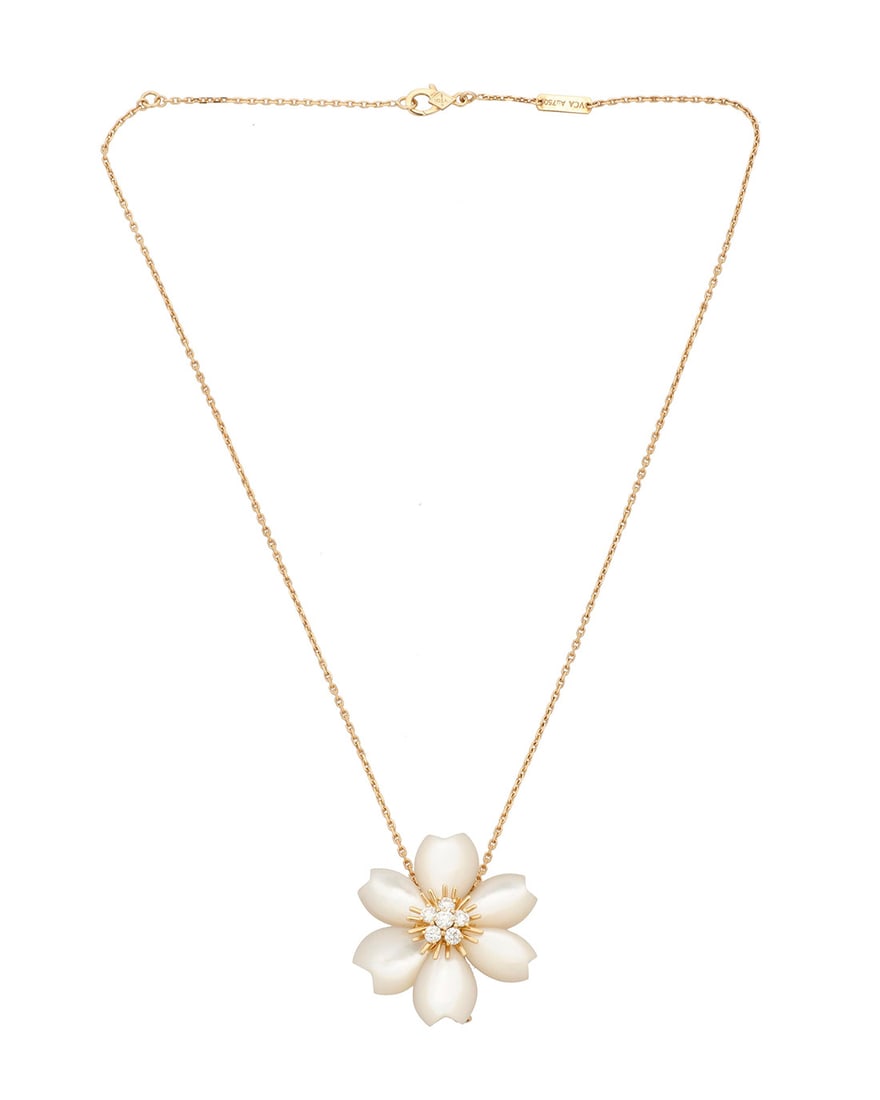 Van Cleef & Arpels: An 18K Gold, Mother-of Pearl and Diamond 'Rose de Noel' Necklace: Van Cleef & Arpels: An 18K Gold, Mother-of Pearl and Diamond 'Rose de Noel' Necklace Of a floral design featuring carved mother-of pearl petals centering six round diamonds, suspended from a gold