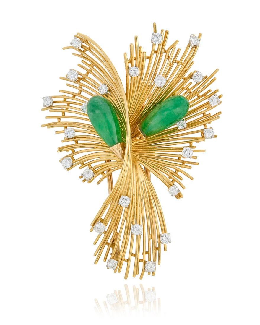 An 18K Gold, Jade and Diamond Brooch, France: An 18K Gold, Jade and Diamond Brooch, France Of a spray design featuring two drop style jade elements accented by round diamonds weighing approximately 1.20 carats Measures: 2 1/2 x 1 3/4 in. 17.1