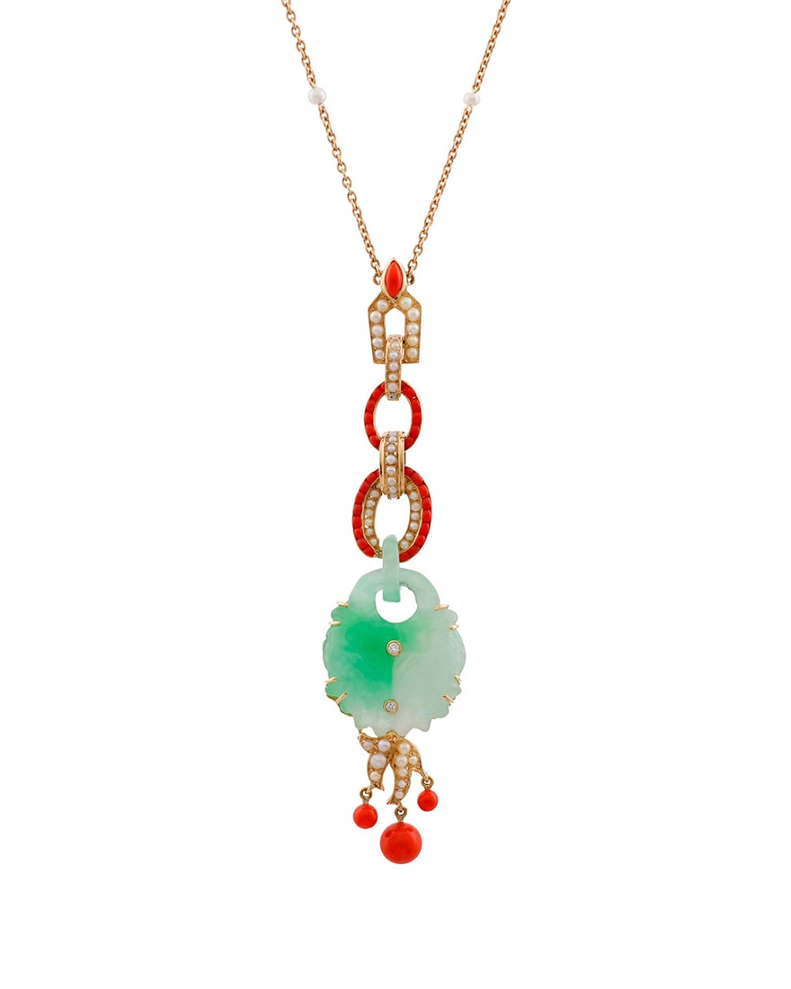An 18K Gold, Jade, Coral and Seed Pearl Necklace: An 18K Gold, Jade, Coral and Seed Pearl NecklaceFeaturing a carved jade double fish motif, accented by seed pearls and coral beadsLength: 16 in., Pendant: 3 1/2 x 7/8 in.14.3 grams gross