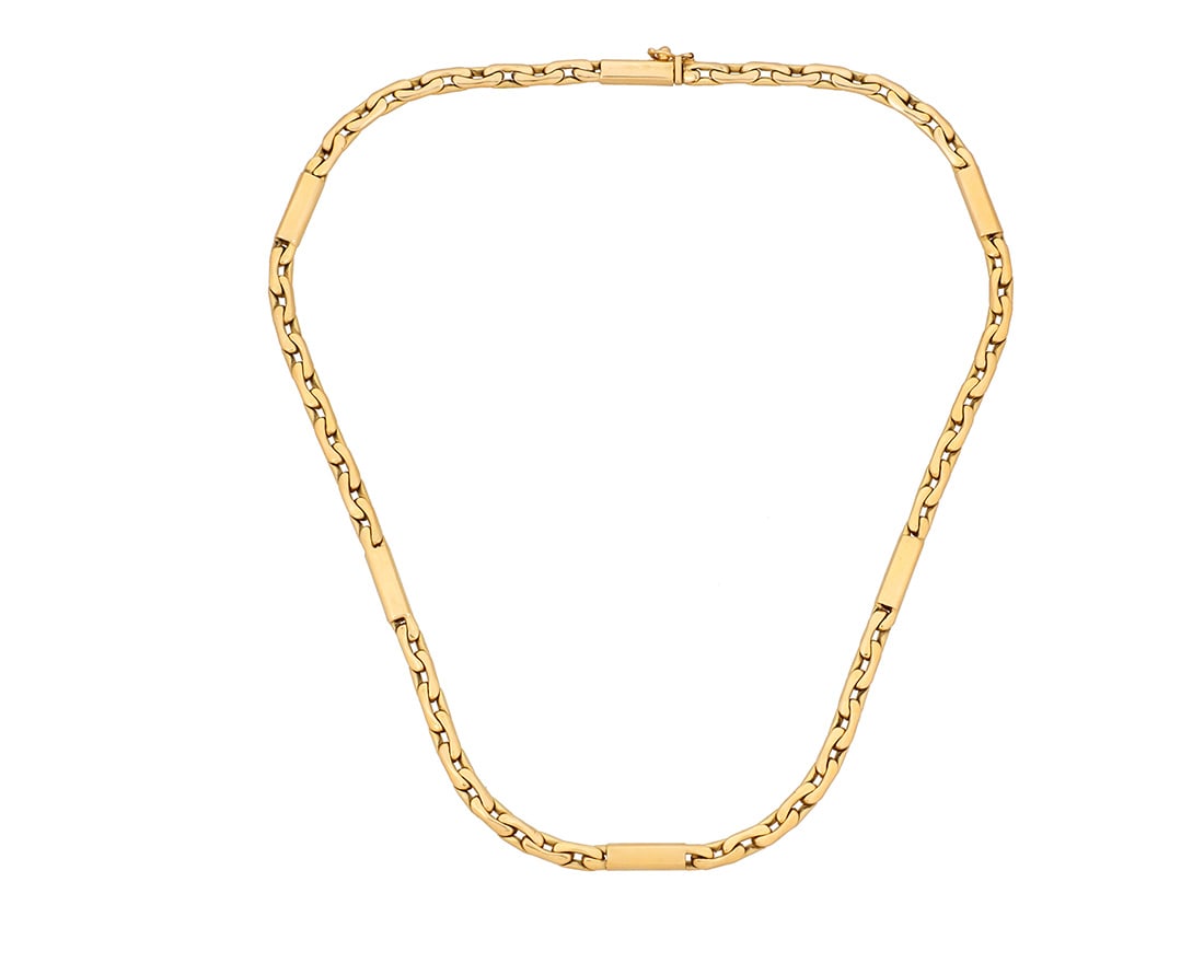 An 18K Gold Chain: An 18K Gold Chain Featuring interlocking link design with high polished gold bar stations Length: 20 in. 63.4 grams gross