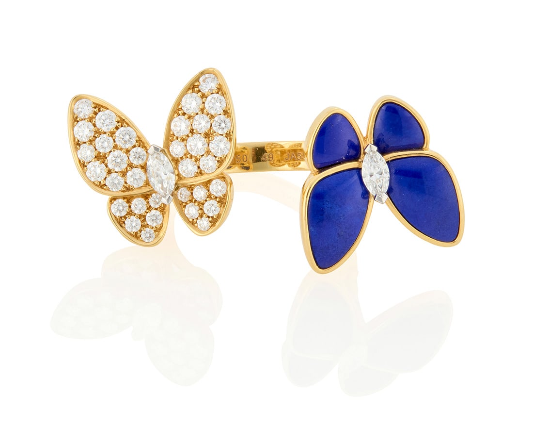 Van Cleef & Arpels: An 18K Gold, Lapis Lazuli and Diamond 'Butterfly Between the Finger' Ring: Van Cleef & Arpels: An 18K Gold, Lapis Lazuli and Diamond 'Butterfly Between the Finger' RingFeaturing two butterflies in flight set with round and marquise-shaped diamonds weighing approximately 1.00