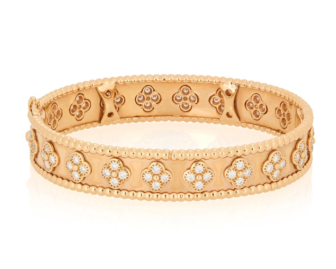Van Cleef & Arpels: An 18K Rose Gold and Diamond 'Perlee Clover' Bangle Bracelet (1 of 3)