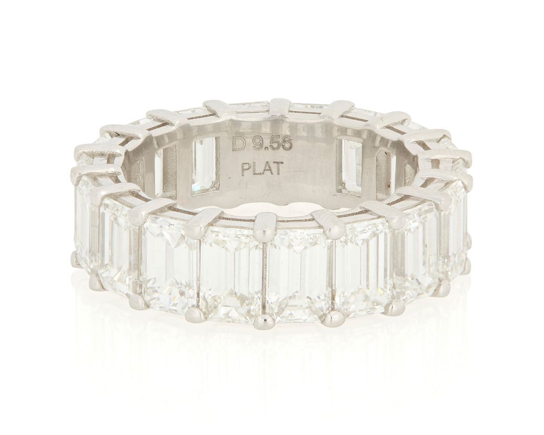 A Platinum and Diamond Eternity Band: A Platinum and Diamond Eternity BandFeaturing eighteen emerald-cut diamonds weighing approximately 9.56 caratsSize: 6 1/48.9 grams gross