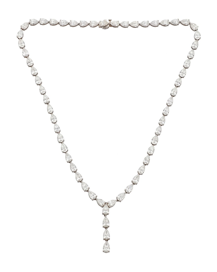 A Platinum and Diamond Lariat Necklace: A Platinum and Diamond Lariat Necklace Featuring sixty pear-shaped diamonds weighing 35.11 carats Length: 17 in., Lariat 1 1/4 in. 35.8 grams gross