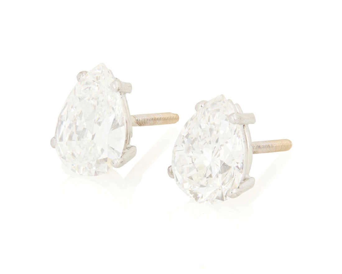 A Pair of Platinum and Diamond Stud Earrings: A Pair of Platinum and Diamond Stud Earrings Featuring pear-shaped diamonds weighing 1.23 carats and 1.65 carats 2 pieces Measures: 3/8 x 1/4 in. 2.1 grams gross Accompanied by a COPY of the GIA