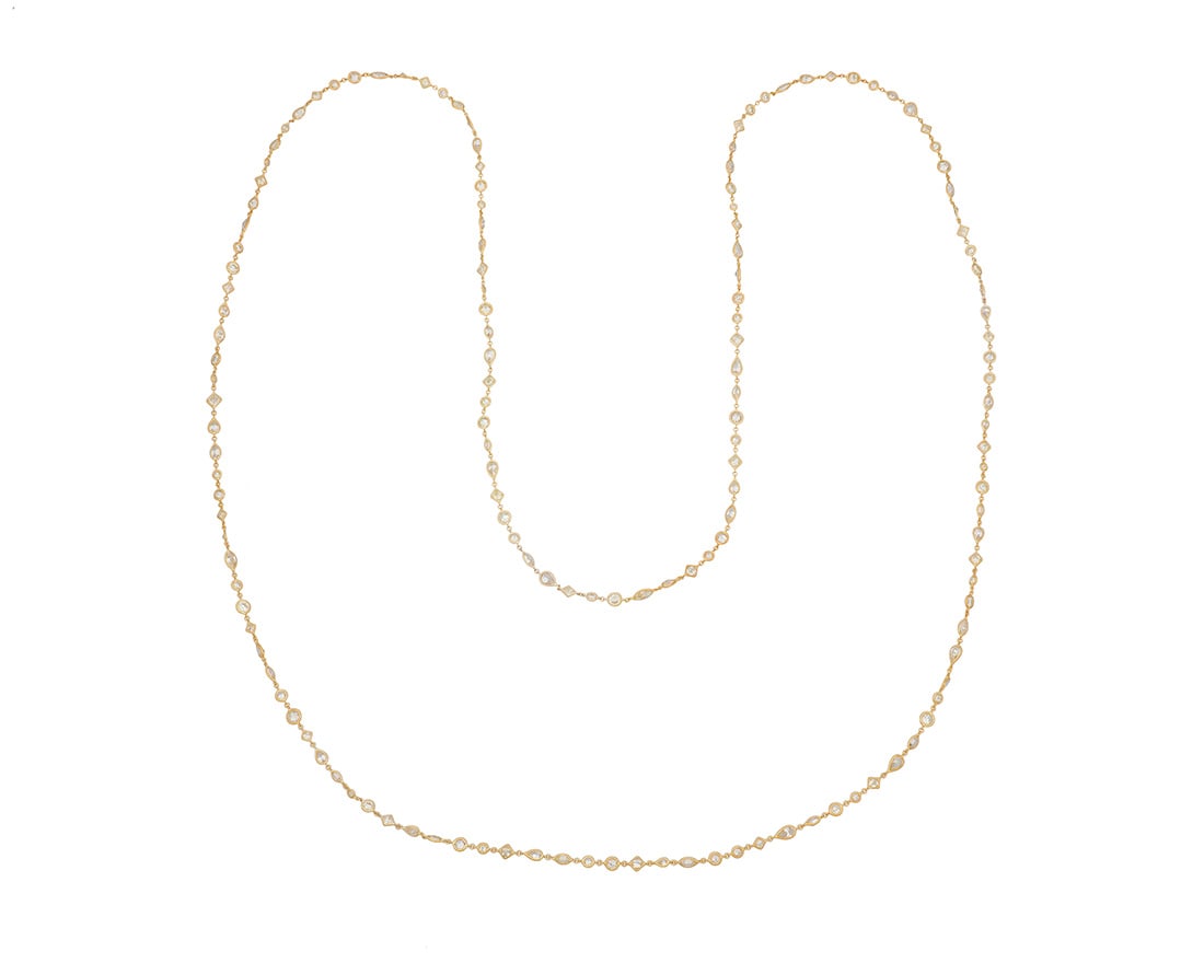 A 14K Gold and Diamond Long Chain: A 14K Gold and Diamond Long Chain Featuring various sizes of marquise-shaped, pear-shaped, square-cut and round diamonds weighing approximately 48.27 carats Length: 62 in. 31.5 grams gross