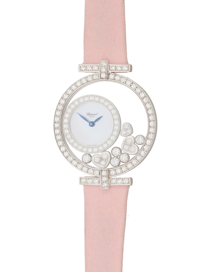Chopard: An 18K White Gold 'Happy Diamonds' Watch: Chopard: An 18K White Gold 'Happy Diamonds' WatchDial: 15.00 mm, round mother-of pearl with no hour markers, accented by freely set round diamonds in a heart motifCase: 35.00 mmCase number:†761 1, s