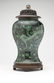 A Chinese green & mirror black porcelain vase