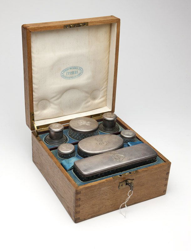 A Grachev Russian silver & cut crystal vanity set: Late 19th century, St. Petersburg, 84-standard, Cyrillic maker's mark ''KA'', comprising: a rectangular box (1.625'' H x 7.625'' W x 2.125'' D), an oval box (1.625'' H x 4.5'' W x 2.875'' D), a circul