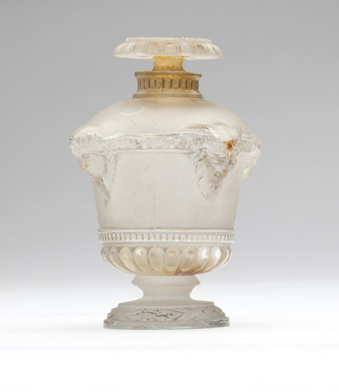 An R. Lalique 'Bouquet de Faunes' perfume bottle: Circa 1925, molded mark ''Guerlain Paris'' to body, underside of body etched ''309 / 4'', the stopper also etched ''309'', the bottle designed by Rene Lalique, of grey-patinated frosted and clear glas