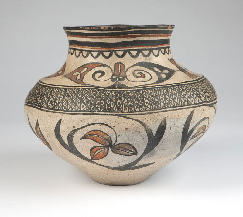 A San Ildefonso olla-shaped water jar: Early 20th century, polychrome-decorated to exterior and to interior of rim, 9'' H x 12'' Dia., est: $1000/1500
