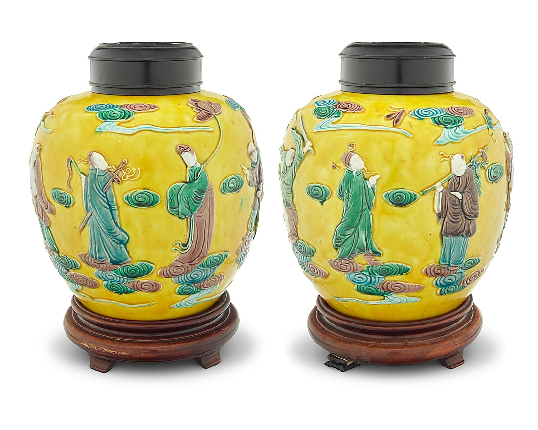 A pair of Chinese yellow ground ceramic ginger jars: A pair of Chinese yellow ground ceramic ginger jars Qing Dynasty (1644-1912) or later Each bearing Wang Bingrong maker's mark in glazed relief Decorated with molded figures in low relief, with carved