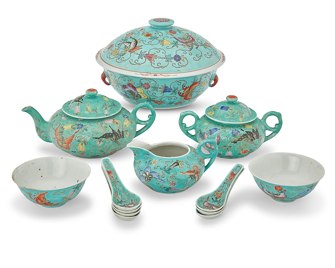 A Chinese turquoise ground porcelain tea service: A Chinese turquoise ground porcelain tea service First half 20th century Each bearing red reign mark for Qianlong Period (1736-1795); most stamped: CHINA With enameled butterfly and vine design,