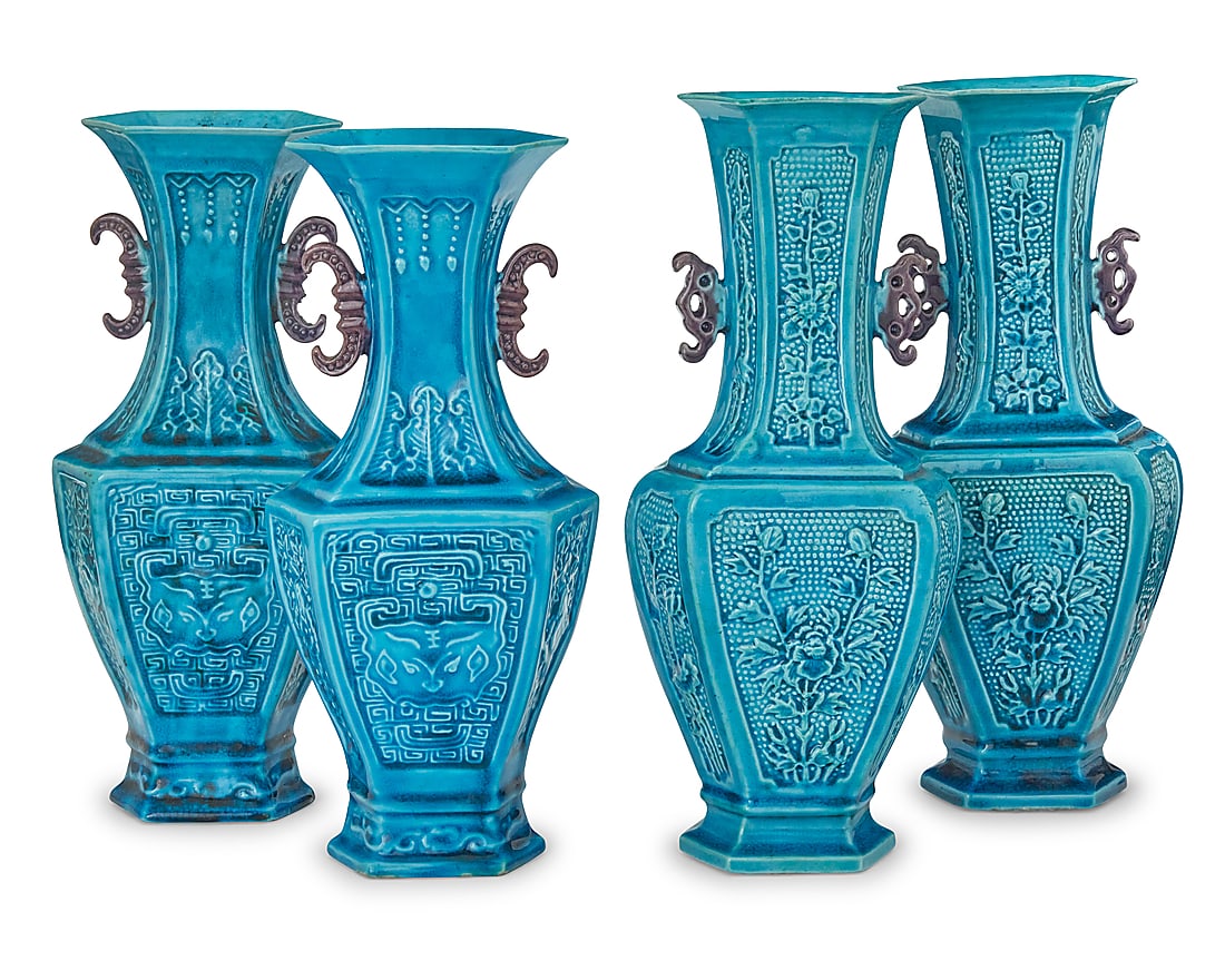 Two pairs of Chinese turquoise glazed pottery archaistic vases: Two pairs of Chinese turquoise glazed pottery archaistic vases Circa 1900 One pair depicting taotie masks, the other decorated with floral motifs and opposed bat-form handles 4 pieces Each floral: 10"