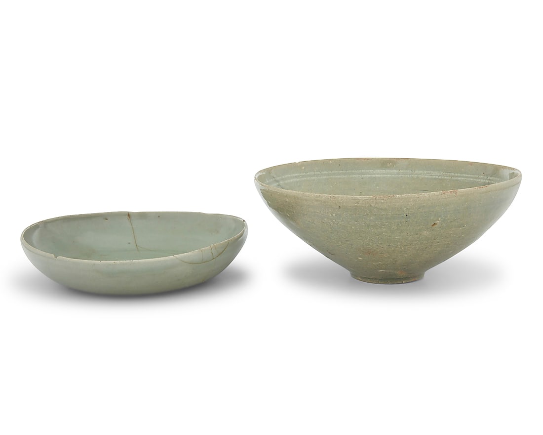 Two Korean celadon ceramic dishes: Two Korean celadon ceramic dishes Goryeo Period (918-1392) or style Comprising one undecorated and one with incised floral motifs to interior 2 pieces Larger: 3" H x 7.5" Dia.; Smaller: 1.5" H x