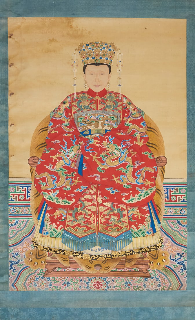 A 19th century ancestor portrait of a lady: A 19th century ancestor portrait of a lady Pigment and gold on paper, edged with fabric and mounted to wooden dowels Inscribed faintly in black ink, in Chinese, presumably by another hand, at the top