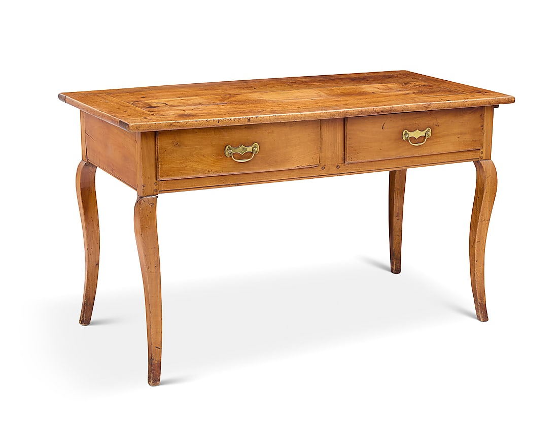 A Louis XV provincial fruitwood desk: A Louis XV provincial fruitwood desk Mid-18th century The two drawers with later brass pulls, with pull slide, raised on cabriole legs 30" H x 51.5" W x 25.25" D