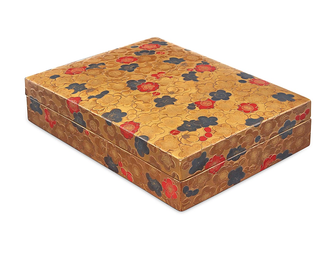 A Japanese maki-e lacquer suzuribako calligraphy box: A Japanese maki-e lacquer suzuribako calligraphy box Meiji Era (1868-1912) Each interior box inscribed for its contents The gilt and pigmented lacquer box exterior decorated with floral motifs in low 