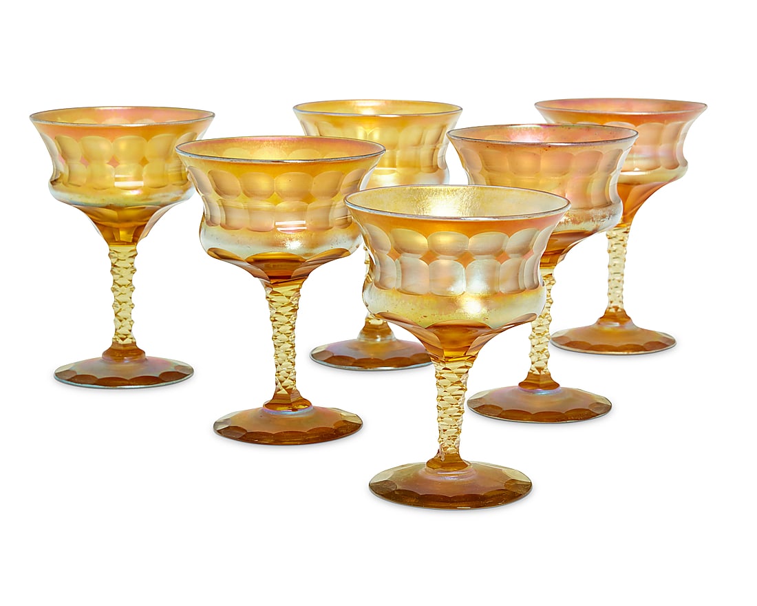 Six Tiffany cut Favrile glass goblets: Six Tiffany cut Favrile glass goblets Early 20th century Each etched: L.C.T. / Favrile / J 1197 6 pieces Largest: 5" H x 3.75" Dia.; Shortest: 4.625" H x 3.5" Dia.