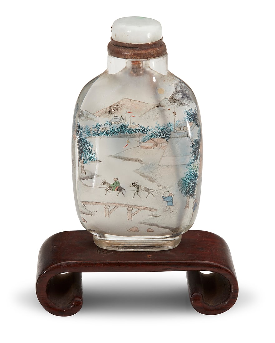 A Chinese interior painted rock crystal snuff bottle: A Chinese interior painted rock crystal snuff bottle Republic Period (1912-1949) Bearing signature of Ye Zhongsan and cyclical date likely to 1937 Depicting a mountain town scene, raised on a carved w