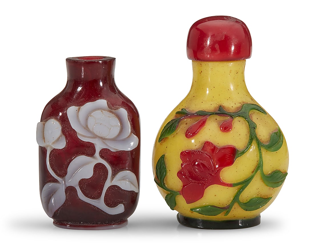 Two Chinese glass overlay snuff bottles: Two Chinese glass overlay snuff bottles 19th/20th century Comprising one mallow flower and another red flower on yellow ground 2 pieces Yellow ground: 3.125" H x 2" W x 1.625" D; Mallow: 2.5" H x 1.5"