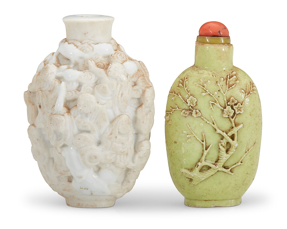 Two Chinese carved porcelain snuff bottles: Two Chinese carved porcelain snuff bottles Qing Dynasty (1644-1912) or later The white inscribed to underside: CHINA Comprising a 'One Hundred Boys' white porcelain bottle and a pale green bottle carv