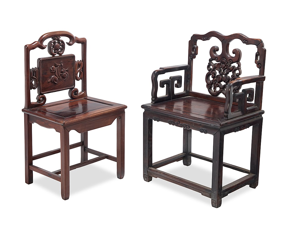 Two Chinese carved hardwood chairs: Two Chinese carved hardwood chairs 20th century One with openwork seatback carved with a bat and peaches, the other carved with peaches and scroll elements 2 pieces Bats: 38.75" H x 25.5" W x 20" D;