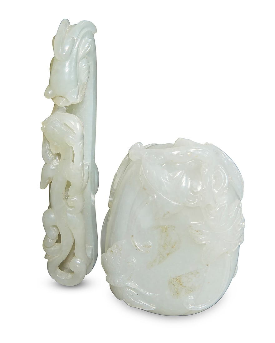 Two Chinese carved jade articles: Two Chinese carved jade articles 19th century or later Comprising a belt hook/buckle depicting a chilong figure, and a decorative item carved with a gourd, leaves, and a butterfly, together with an