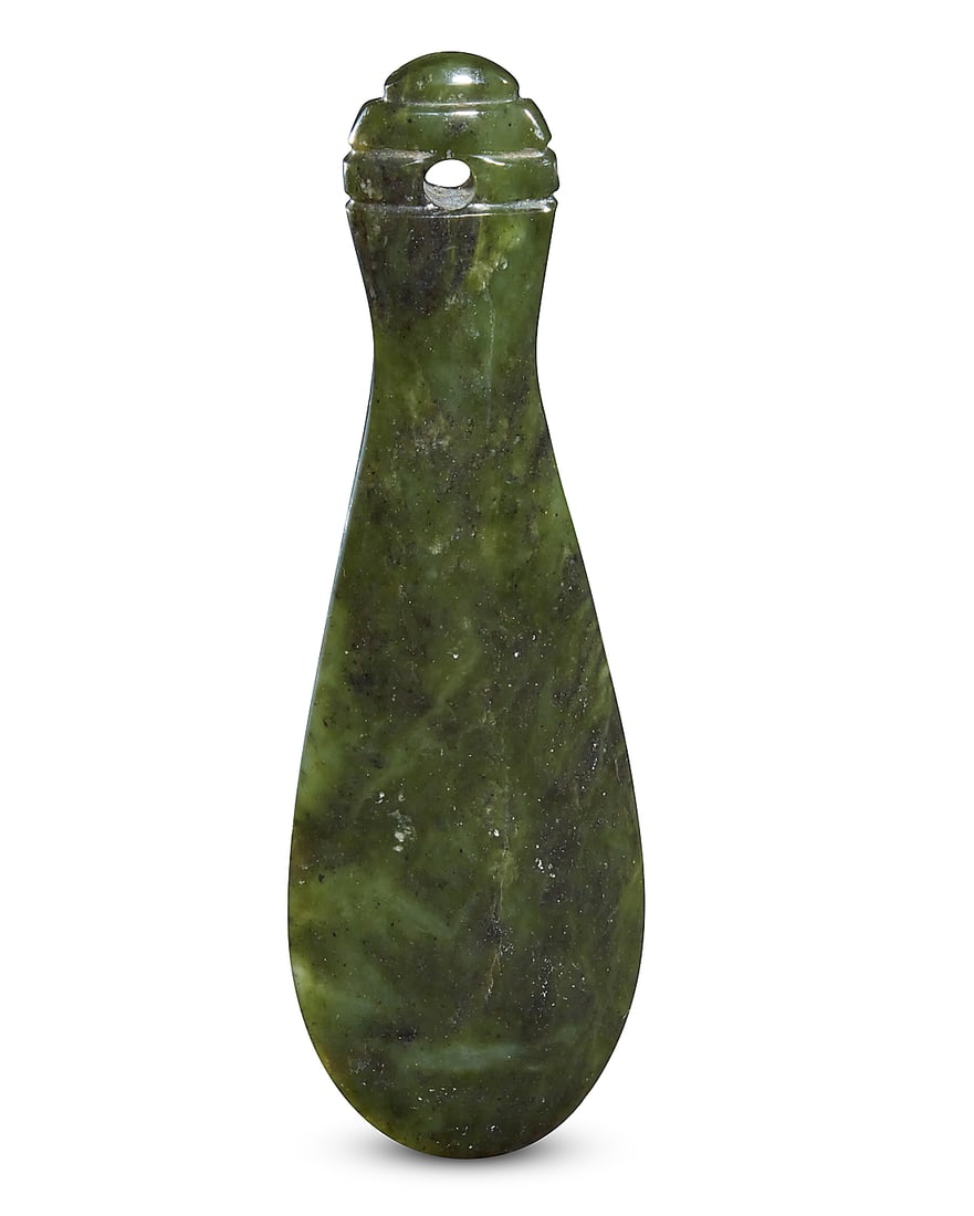 A New Zealand mere pounamu: A New Zealand mere pounamu 20th century, possibly Maori The nephrite jade short club with broad rounded blade tapering to a long handle incised with shallow grip ridges and with drilled suspension