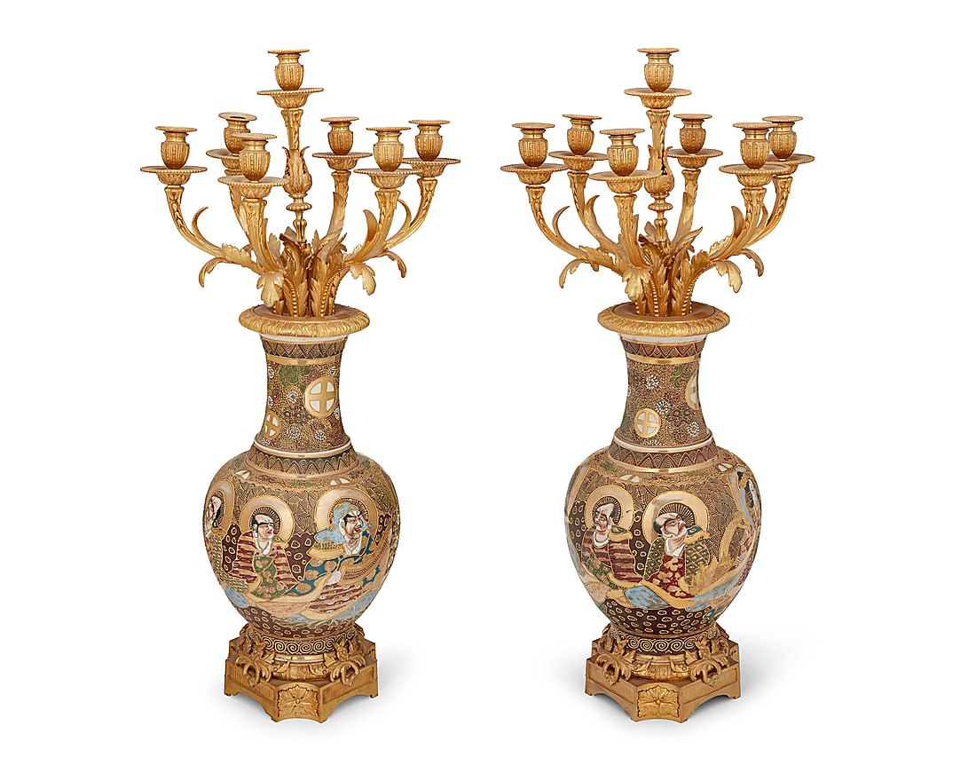 A pair of gilt bronze mounted Japanese Satsuma ceramic candelabra: A pair of gilt bronze mounted Japanese Satsuma ceramic candelabra Early 20th century One impressed: F. BARDBEDIENNE; each bearing red underglaze Satsuma marks to underside Each urn with gilt, moriage,
