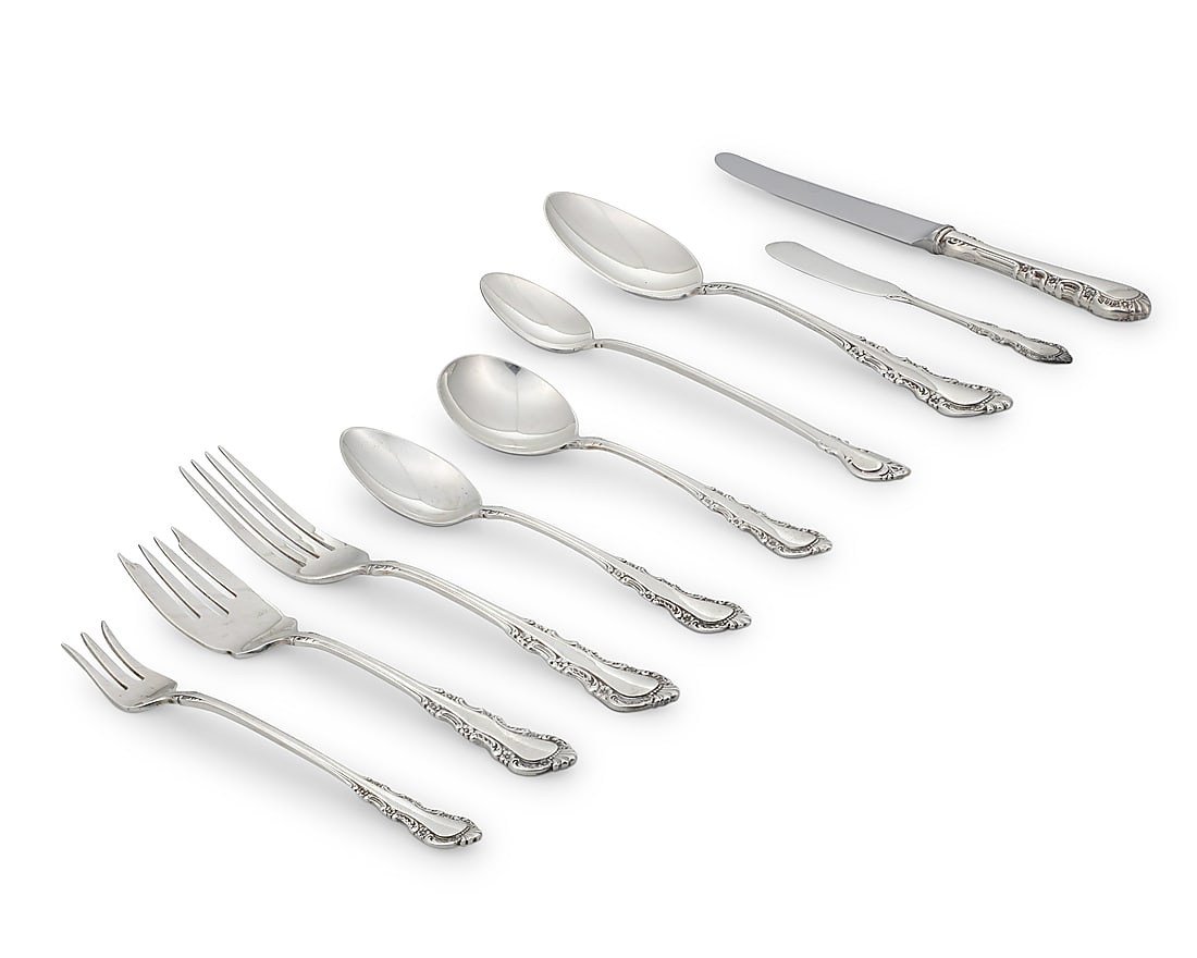 A Reed & Barton sterling silver 'Georgian Rose' flatware service: A Reed & Barton sterling silver 'Georgian Rose' flatware service Mid-20th century Designed 1941 Each marked for maker and sterling Comprising: 12 dinner knives (9") 12 butter spreaders, monogrammed