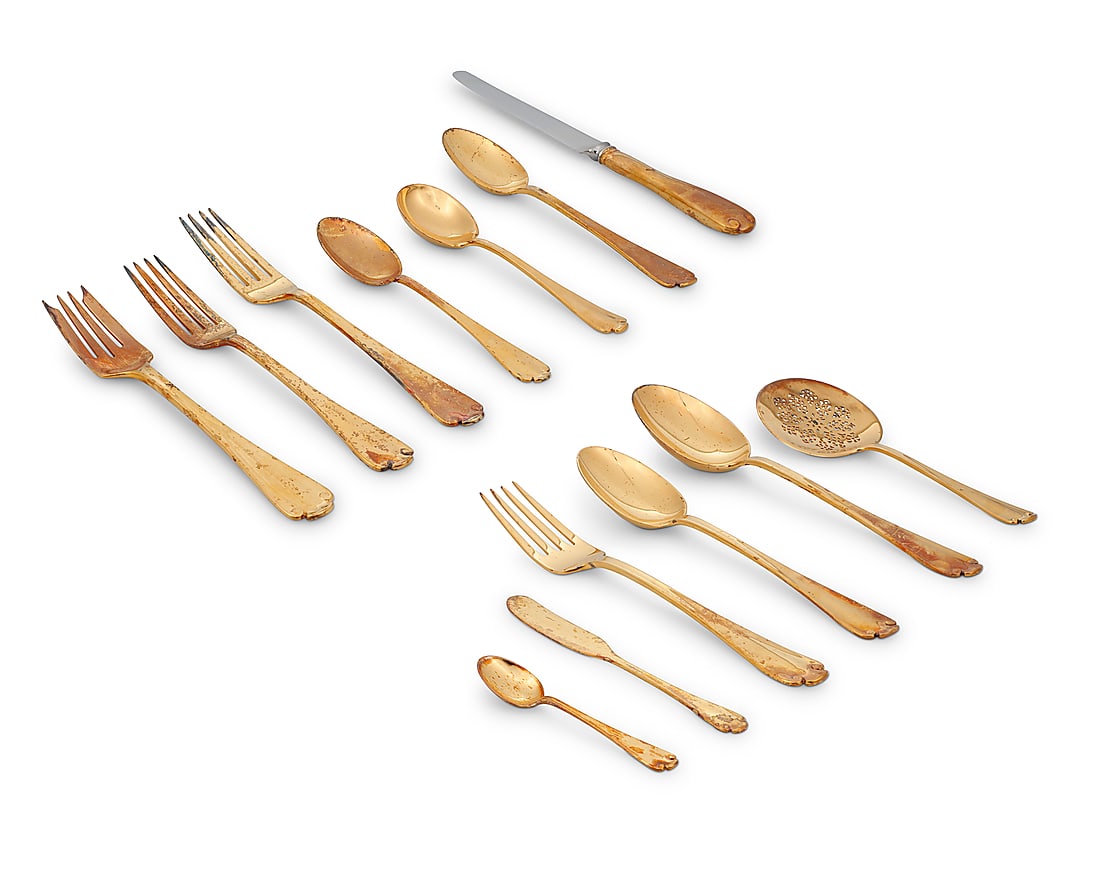 A Tiffany & Co. gilt sterling silver 'Flemish' flatware service: A Tiffany & Co. gilt sterling silver 'Flemish' flatware service Mid-20th century Designed 1911 Each marked for Tiffany, sterling, and 'M' [directorship of John C. Moore (1907-1947)] Comprising: 8