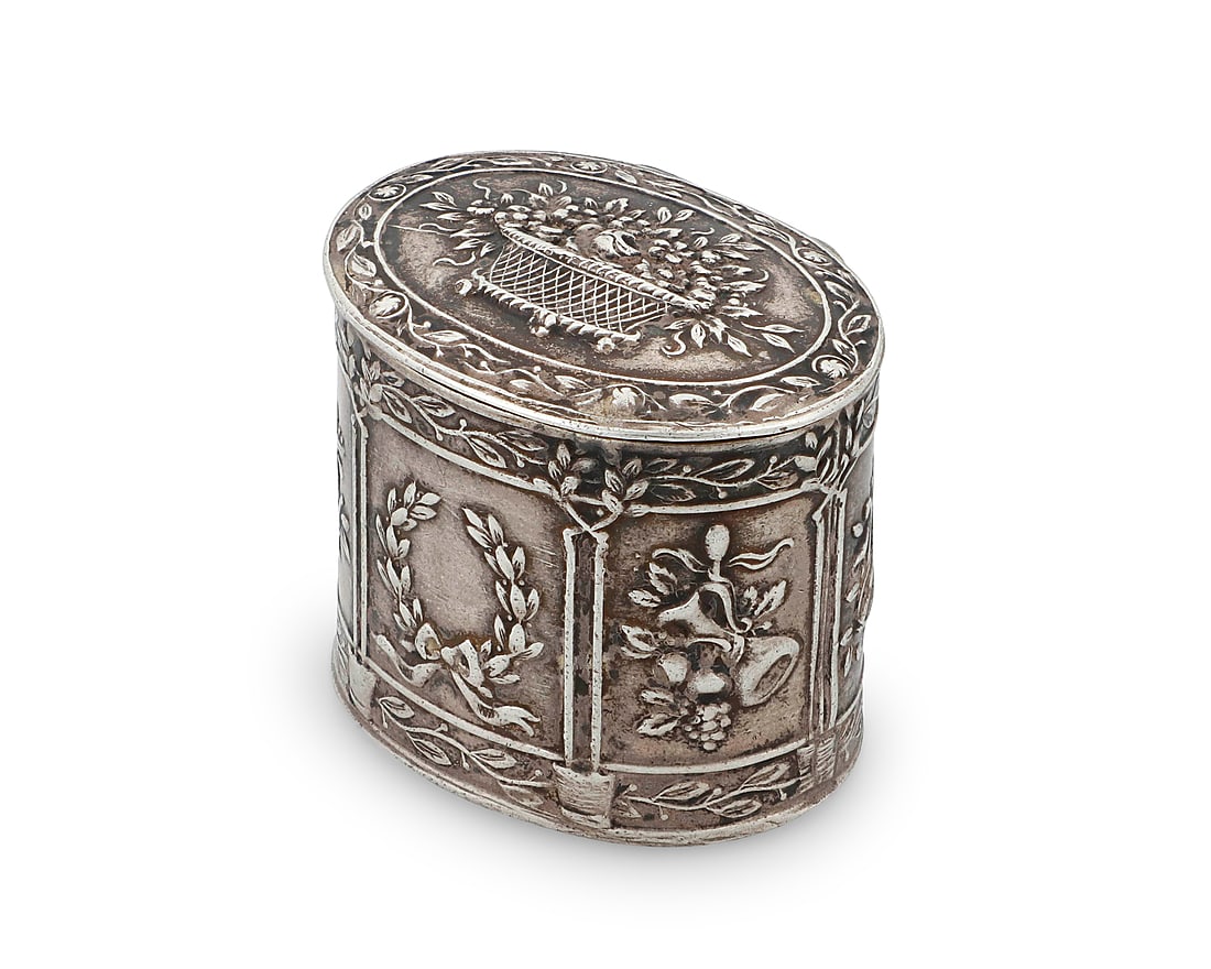 A German Hanau .800 silver patch box: A German Hanau .800 silver patch box Dingeldein Gebr¸der, late 19th/early 20th century With impressed Hanau marks The sides with repousse alternating friezes depicting laurel wreaths, wine bottles