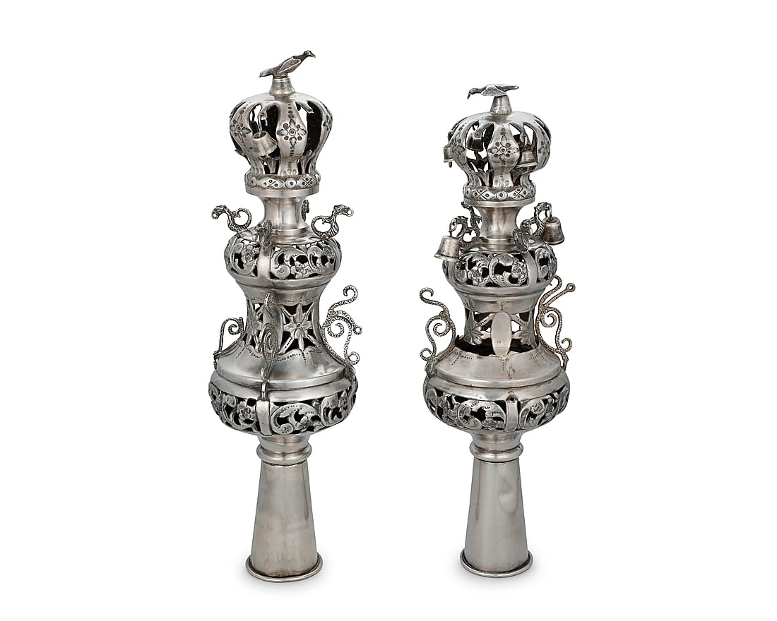A pair of Russian sterling silver Rimonim: A pair of Russian sterling silver Rimonim 19th century Each impressed: 1882 / 84 [zolotnik] / STERLING Each Torah scroll finial decorated with pierced and chased floral motifs, with dragon-form accent