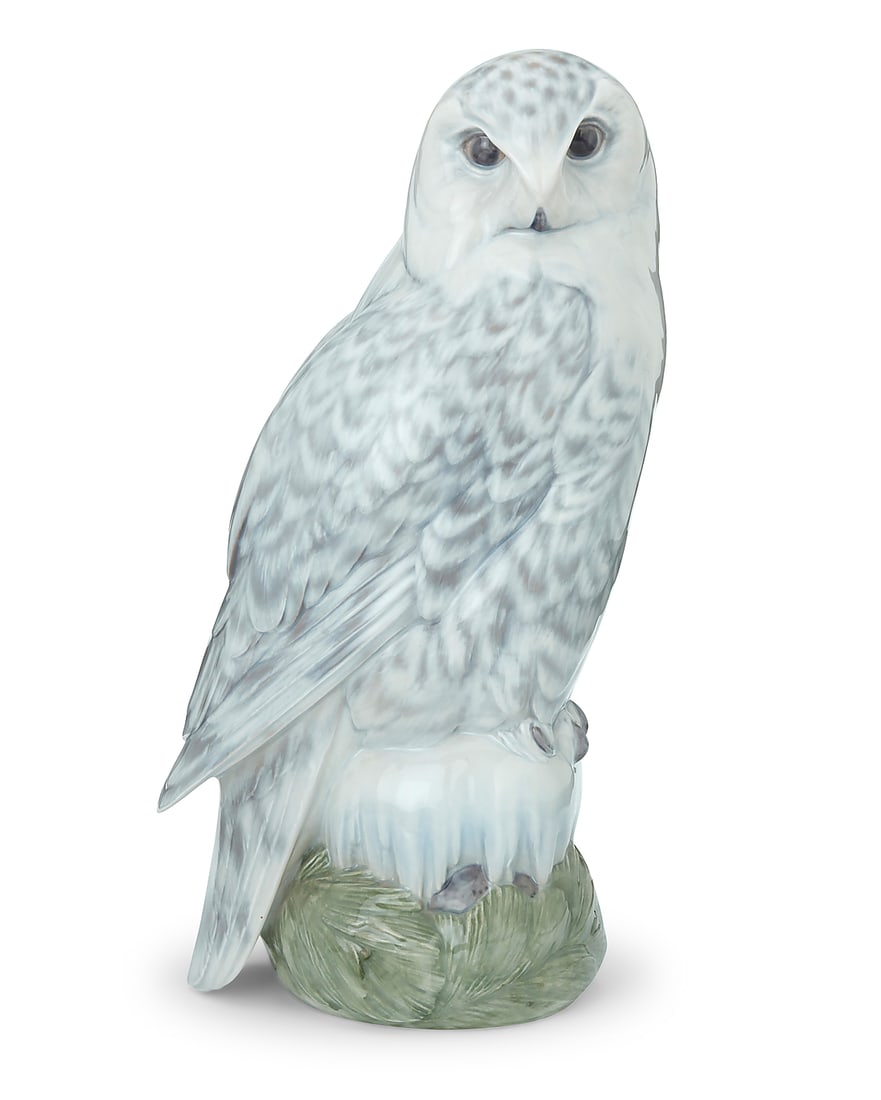 A Royal Copenhagen porcelain owl: A Royal Copenhagen porcelain owl 1951 Designed by Peter Herold (1879-1920) With green printed factory mark above underglaze blue wave and green painted pattern: 1829 / OH; with indistinct incised