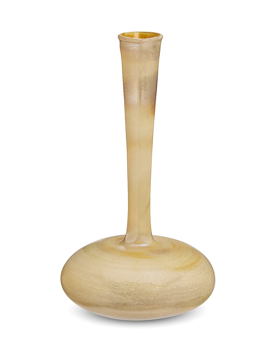 A Roman style glass bud vase: A Roman style glass bud vase 20th century Unmarked The slim tapering long neck above a pillow base, with iridescent and weathered finish 7.625" H x 4.25" Dia.