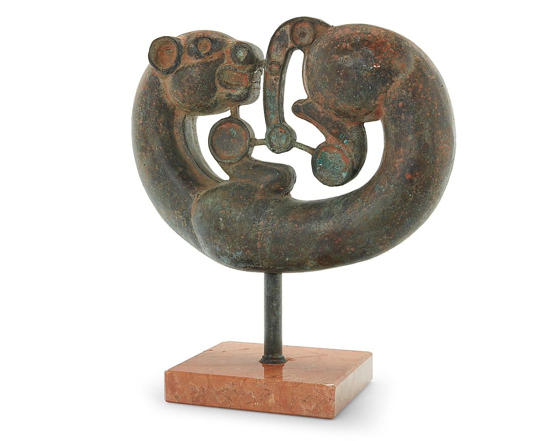 A Scythian style solid bronze coiled panther: A Scythian style solid bronze coiled panther Possibly circa 2500 BCE Mounted on a marble base Figure: 12.25" H x 16.75" W x 4.375" D; Base: 1.625" H x 8.25" W x 7" D; Overall: 18" H Provenance: Simila