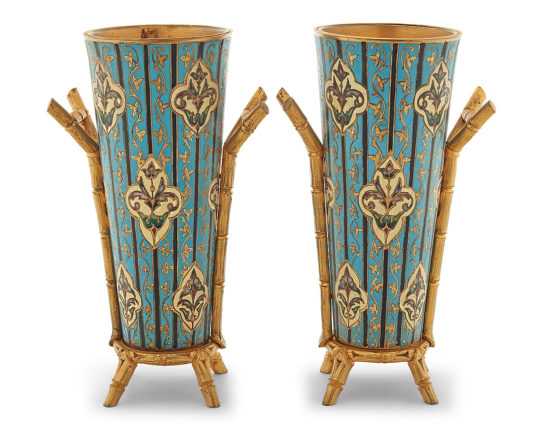 A pair of French gilt bronze and champleve enamel vases: A pair of French gilt bronze and champleve enamel vases Attributed to F. Barbedienne foundry, circa 1890 Each appears unmarked Each vase decorated with foliate motifs, set in a gilt-bronze