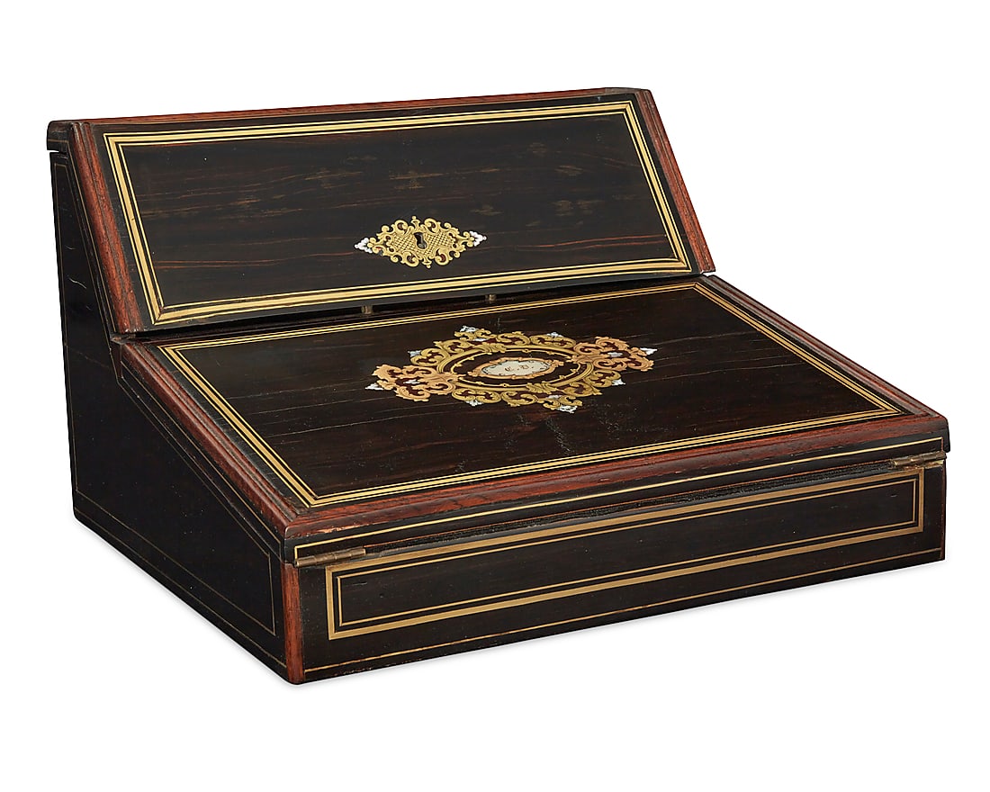 A French inlaid rosewood lap writing desk: Y A French inlaid rosewood lap writing desk Mid-19th century Lock plate with maker's mark: Vervelle Aine With inlaid brass and mother of pearl decoration, opening to reveal letter dividers, a lidded c