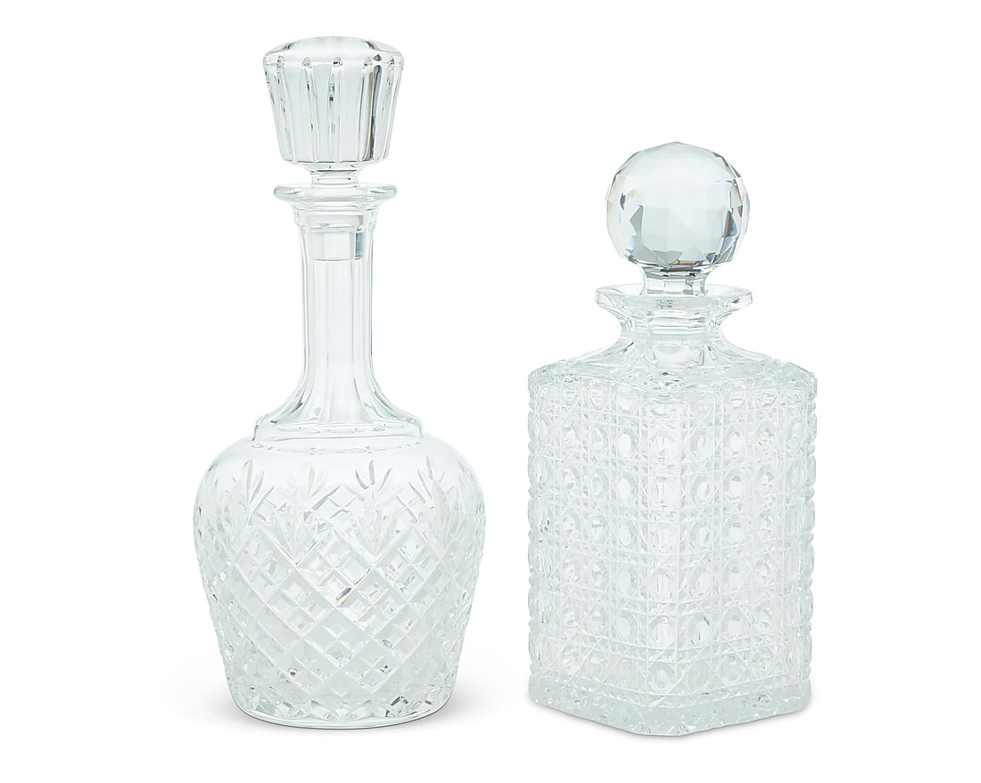 Two Baccarat glass decanters: Two Baccarat glass decanters Late 20th century Each with etched factory mark, one etched: CHIVAS Comprising a wine decanter and a whiskey decanter, each with stopper 2 pieces Wine: 11.25" H x 4.875"