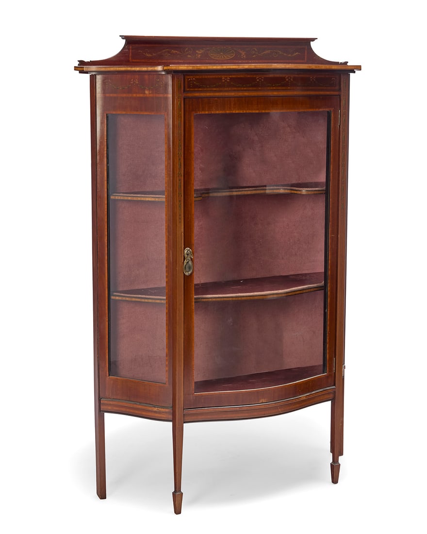 An Edwardian mahogany vitrine: An Edwardian mahogany vitrine Circa 1920 With applied metal plaque: Allen & Appleyard, / ARTISTIC FURNISHERS / RENSHAW STREET & BOLD STREET / LIVERPOOL The case with inlaid trimming and painted with b