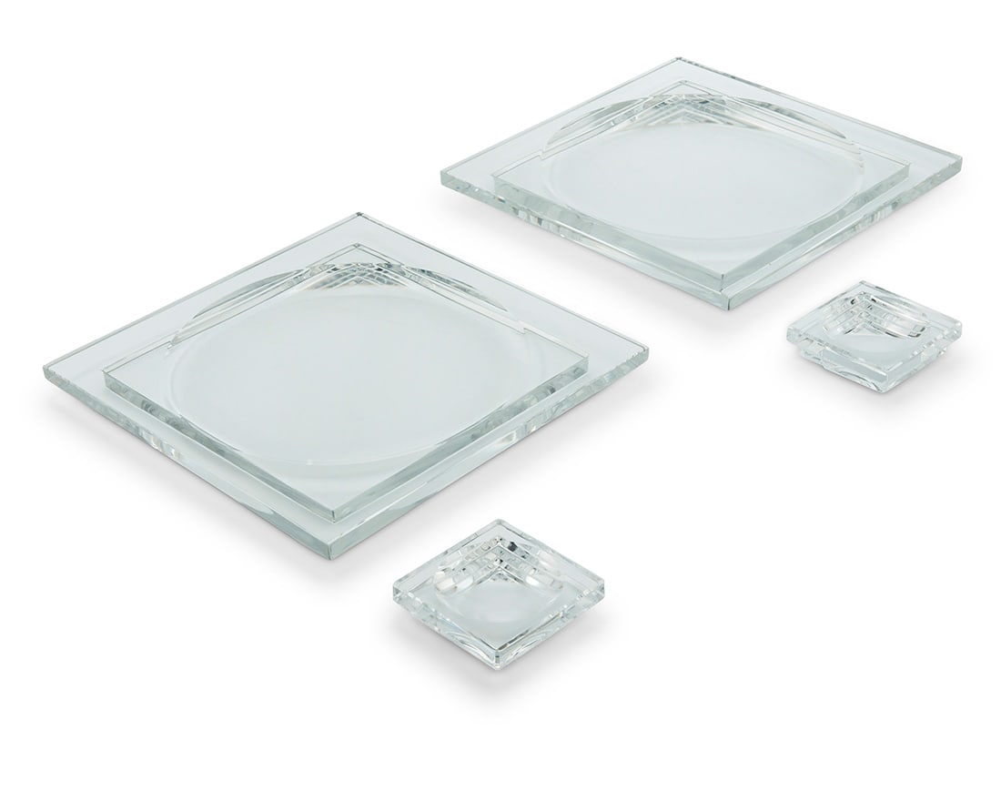 A set of Baccarat glass 'Josephine Baker' plates and salt cellars: A set of Baccarat glass 'Josephine Baker' plates and salt cellars Late 20th/early 21st century Designed by Georges Chevalier (1882-1967) Each with etched factory mark Comprising 12 dinner plates and 2
