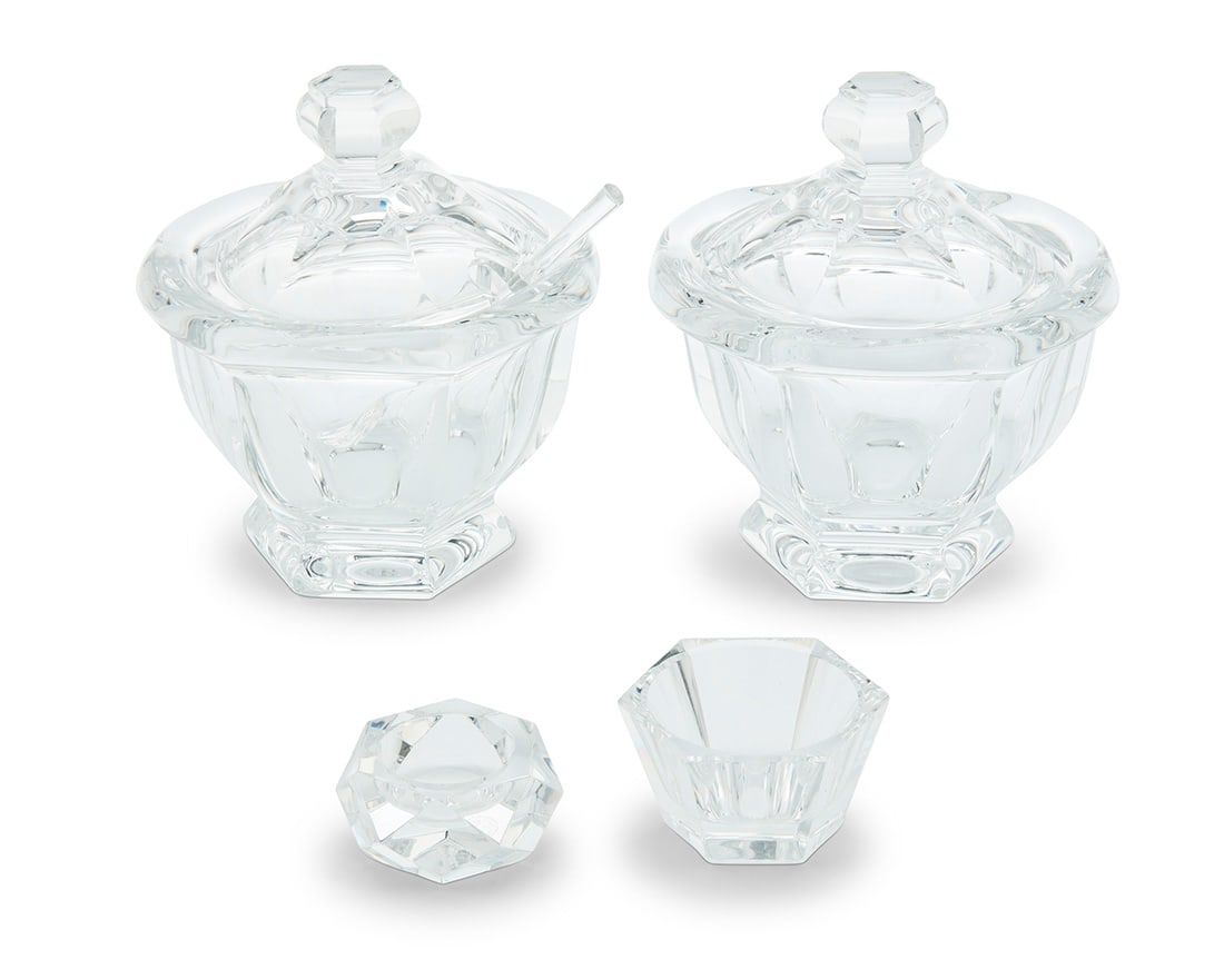 A group of Baccarat glass table items: A group of Baccarat glass table items Mid/late 20th century Each with etched factory mark Comprising two 'Harcourt Missouri' jam/jelly pots and one condiment pot, each housed in original packaging wit