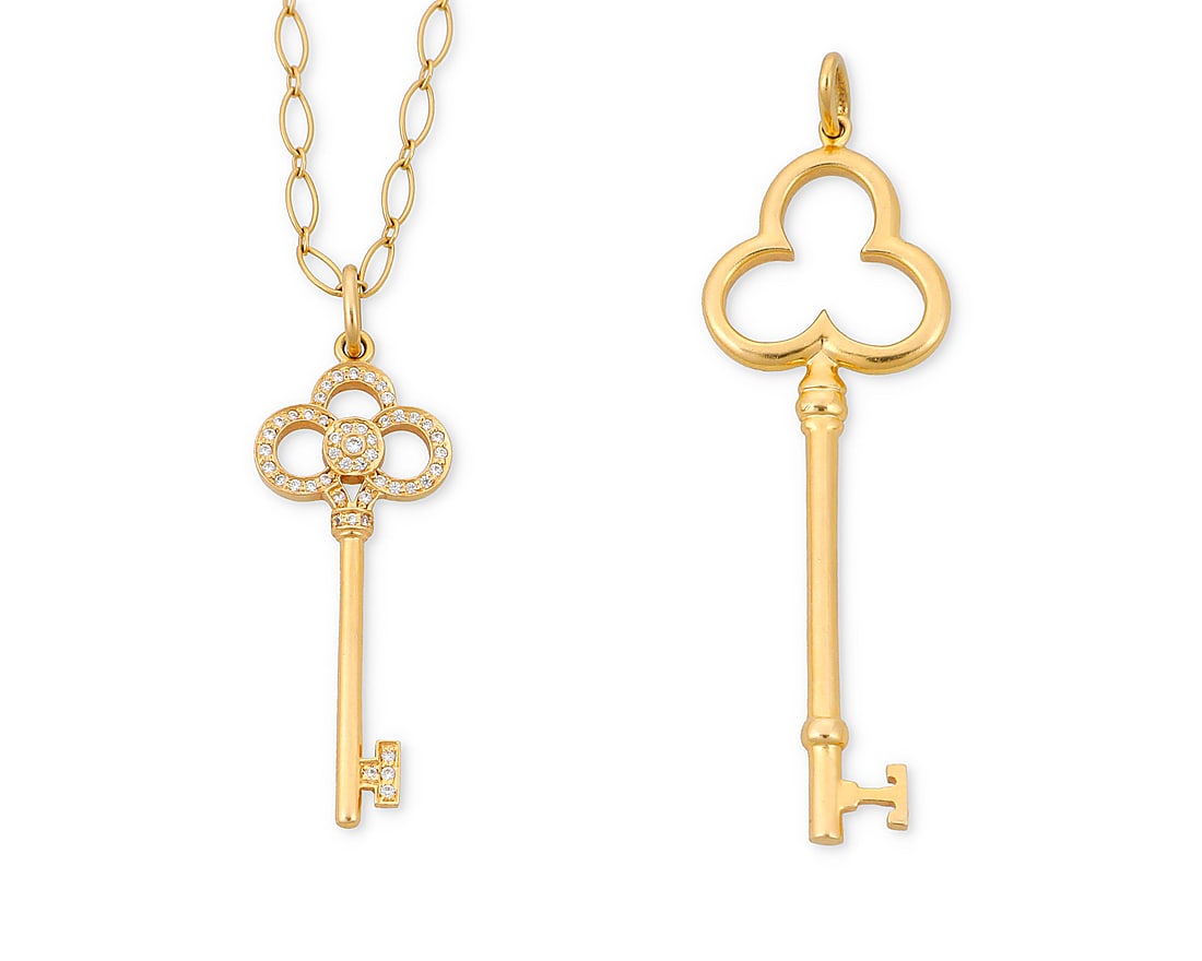 Tiffany & Co.: Two 18K Gold Key Pendants: Tiffany & Co.: Two 18K Gold Key Pendants Including a high polish gold key pendant together with a gold and diamond set key pendant suspended from an 18k gold chain, all signed Tiffany & Co. 2 pieces