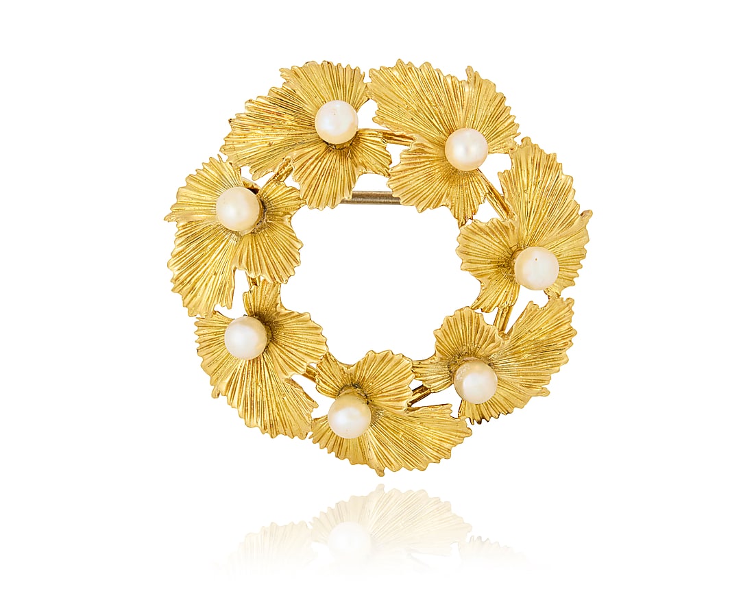 Tiffany & Co.: An 18K Gold and Cultured Pearl Brooch: Tiffany & Co.: An 18K Gold and Cultured Pearl Brooch Of a foliate leaf design accented by seven cultured pearls, signed Tiffany & Co. Measures: 1 1/2 x 1 1/2 in. 11.0 grams gross
