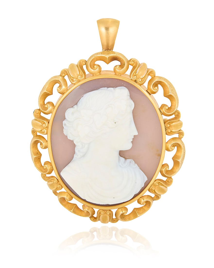 A 14K Gold and Agate Cameo Pendant/Brooch: A 14K Gold and Agate Cameo Pendant/Brooch Centering an oval carved agate cameo of a Bacchus motif set in an ornate frame Measures: 1 3/8 x 2 in. 43.9 grams gross This lot is being offered with no rese