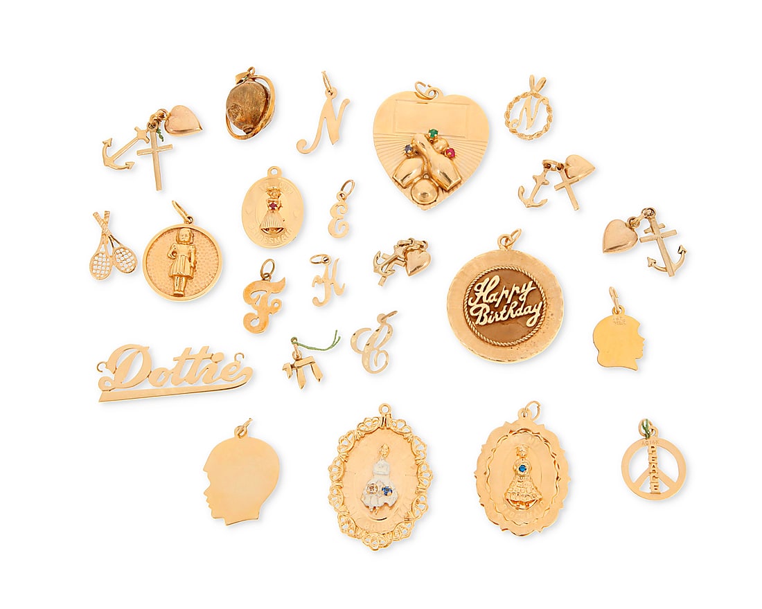 A Group of Gold Charms: A Group of Gold Charms Including a Dottie name plate, brides' maids, initials and a bowl charm 23 pieces Measures: 3/8 - 1 1/2 in. 62.0 grams gross