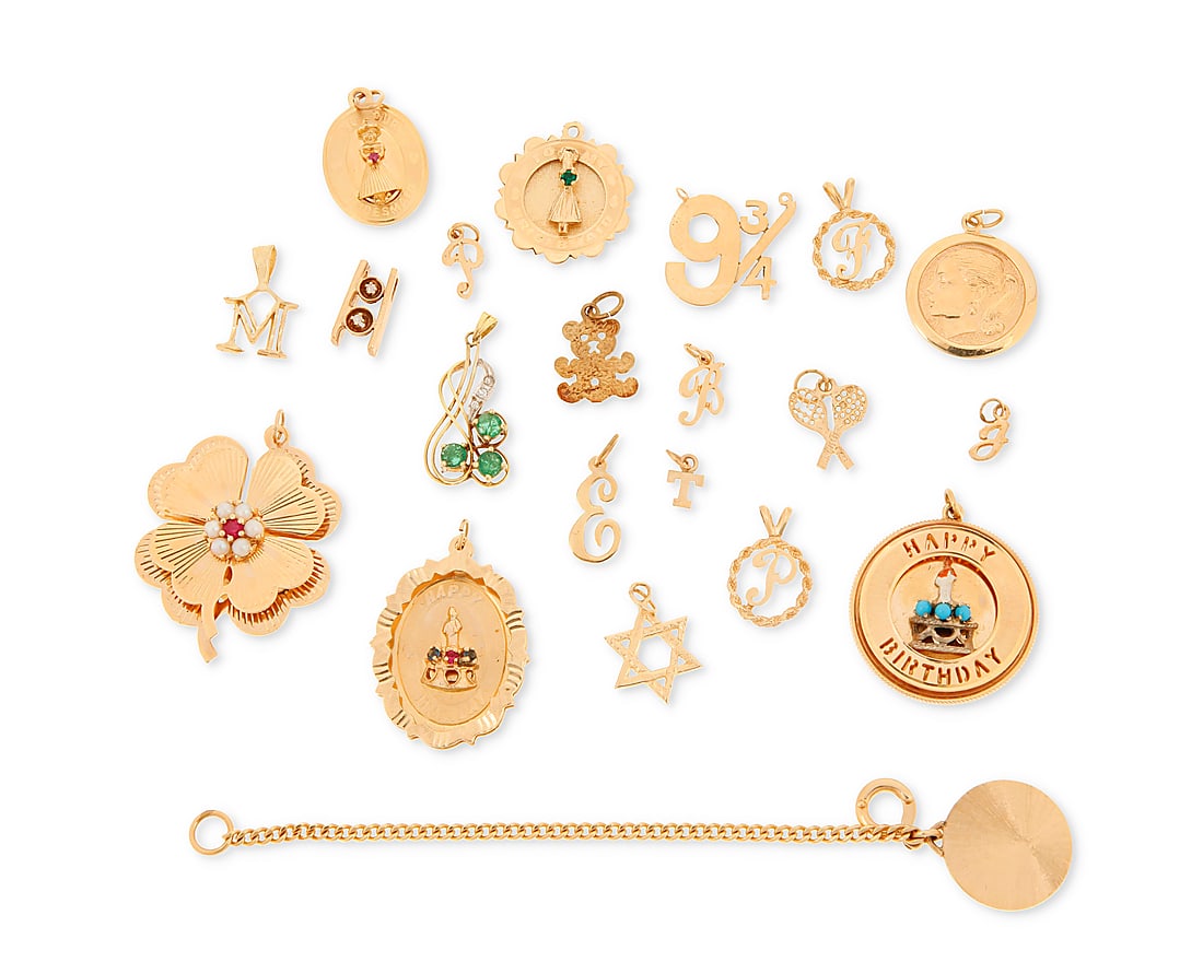 A Group of Gold Charms: A Group of Gold Charms Including a brides maid charm, happy birthday charms, initials and a clover 20 pieces Measures: 3/8 - 1 1/2 in. 46.0 grams gross