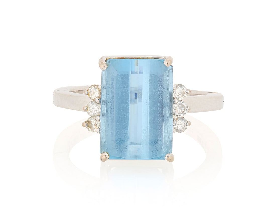 A 14K White Gold, Aquamarine and Diamond Ring: A 14K White Gold, Aquamarine and Diamond Ring Centering a rectangular mixed-cut aquamarine weighing approximately 4.15 carats, accented by six round diamonds Size: 7 with hinged shank 5.2 grams gross