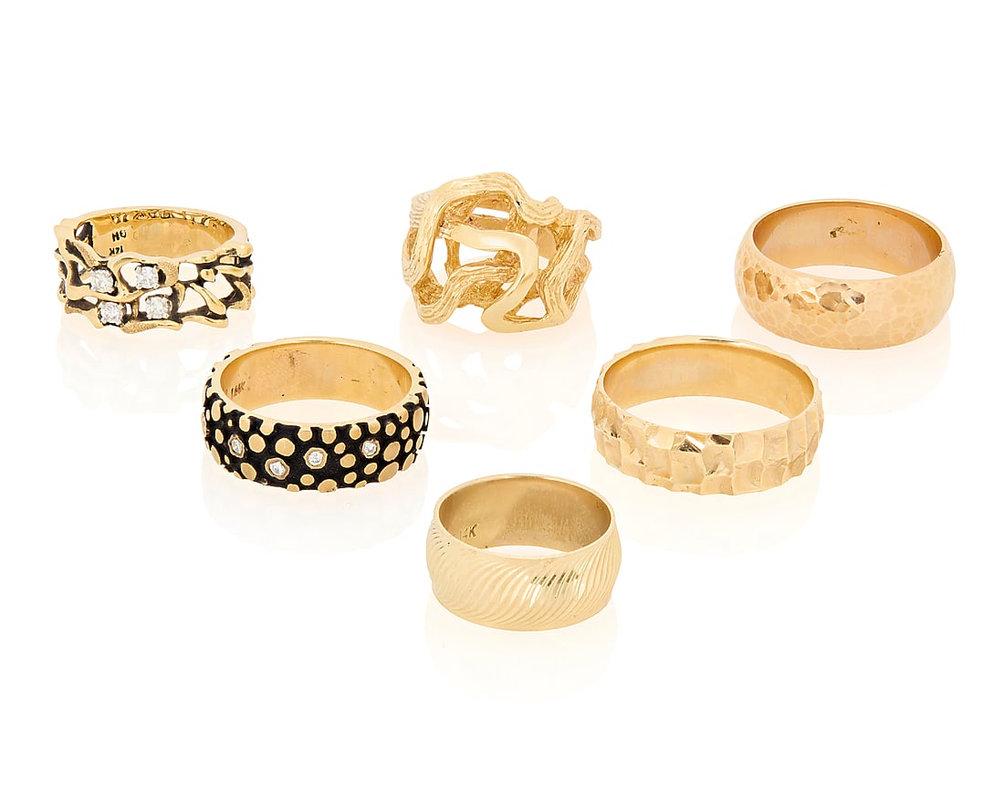 A Group of Six 14K Gold Rings: A Group of Six 14K Gold Rings Featuring nugget and organic textures 6 pieces Sizes: 5 3/4 - 11 48.1 grams gross